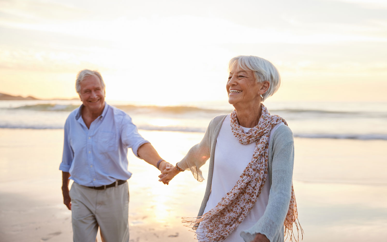 Couple on the beach @ Goodboy Picture Company / iStock